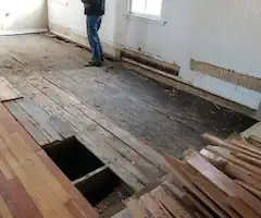 Original floor bowed. Needs a creative solution to be able to handle new floor.
