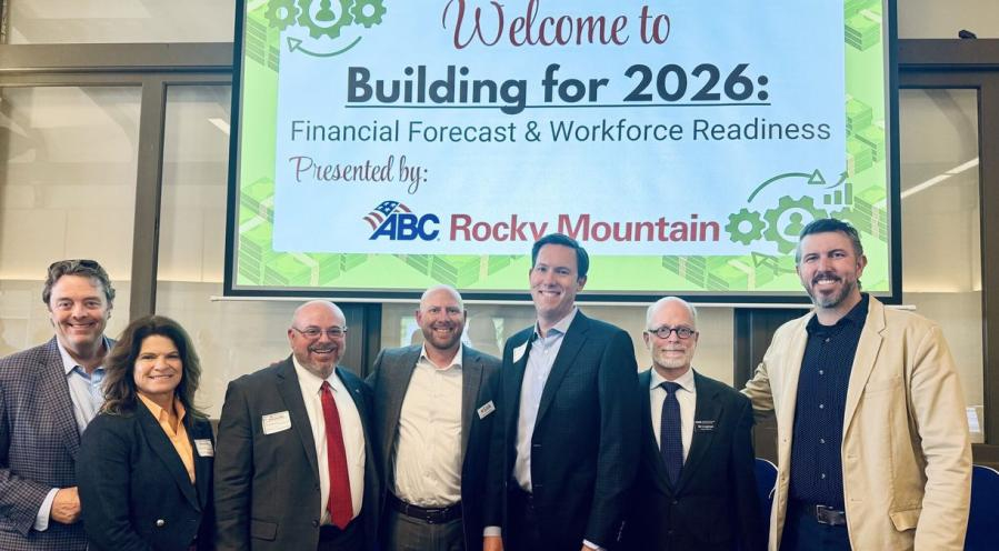 Uriah Kimmig stands with other industry leaders at the ABC Rocky Mountain Financial Forecast & Workforce Readiness event.